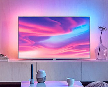 L'éclairage Ambilight 3 côtés des TV The One renforce l'immersion des spectateurs - (crédit : Philips) Illustration du dispositif lumineux Ambilight des TV The One de la série Performance
